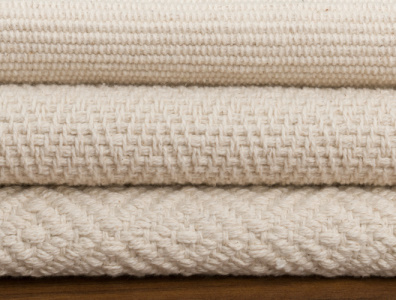 Organic cotton flatweave rugs stacked